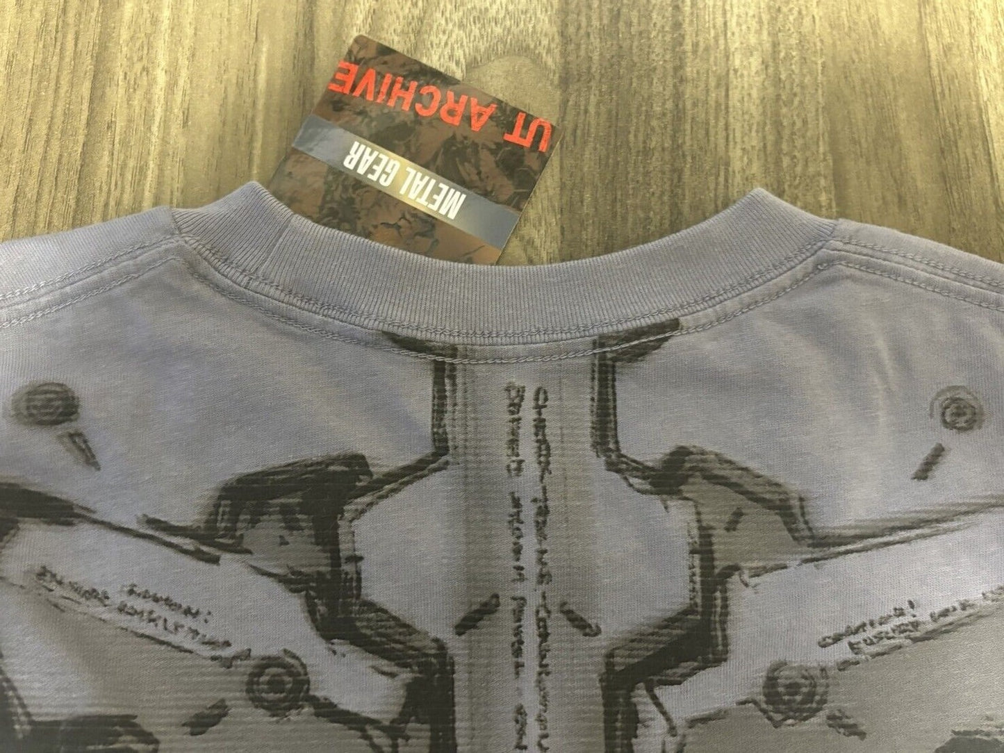bargain price UNIQLO METAL GEAR SOLID ARCHIVE GRAPHIC UT T-SHIRT in Hand Grey