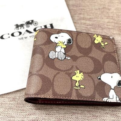 COACH x PEANUTS bi-fold wallet Signature x Snoopy brown