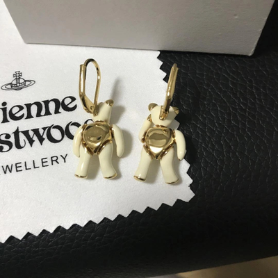 Vivienne Westwood earrings, gold beige, eye stones, movable limbs, box included