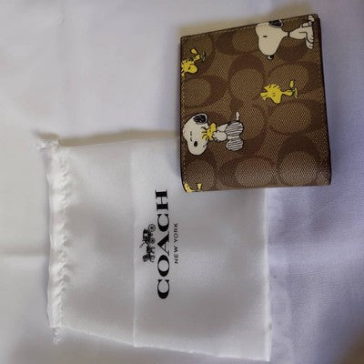 COACH x PEANUTS bi-fold wallet Signature x Snoopy brownsp