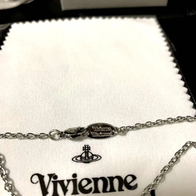 Vivienne Westwood necklace, planet motif, silver, chain 52cm, box included